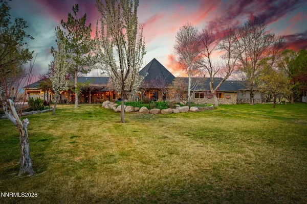 a view of a swimming pool with seating area