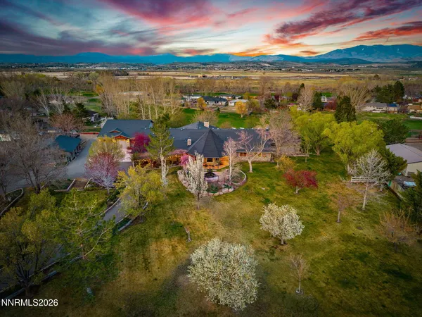 a view of a patio with table and chairs and potted plants