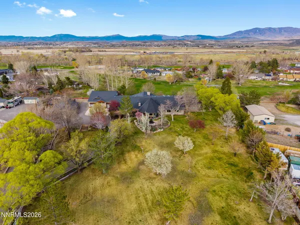 a spacious bedroom with a bed and a couch
