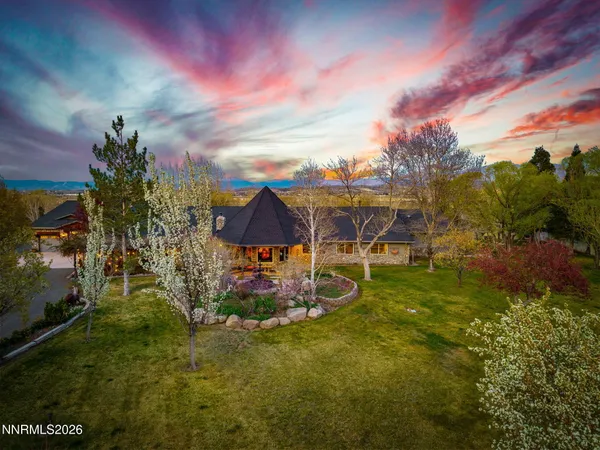 a view of multiple houses with a yard