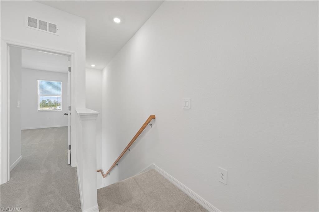 15035 White Pearl Road Babcock Ranch, FL 33982 - Photo 30 of 43 a view of a hallway with entryway