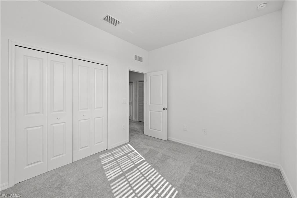 15035 White Pearl Road Babcock Ranch, FL 33982 - Photo 36 of 43 a view of a livingroom with an empty space and a bathroom