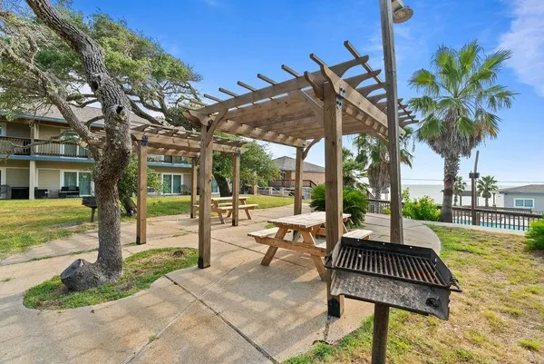 a view of a patio with swimming pool table and chairs