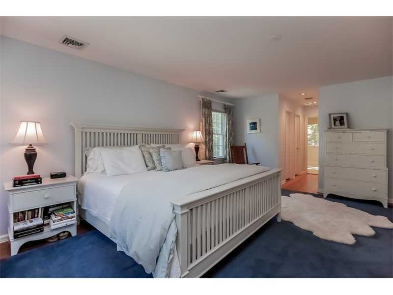 18 Devon Road Darien, CT 06820 - Photo 14 of 25 a bedroom with a bed a mirror and lamp