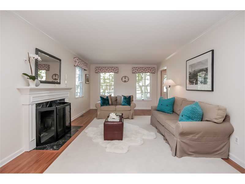 18 Devon Road Darien, CT 06820 - Photo 4 of 25 a living room with furniture and a fireplace