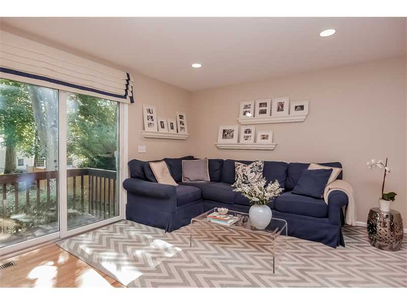 18 Devon Road Darien, CT 06820 - Photo 10 of 25 a living room with furniture and a floor to ceiling window