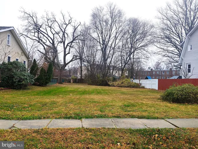 a view of a yard with swimming pool