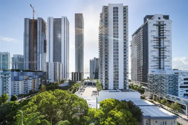 a view of a city with tall buildings