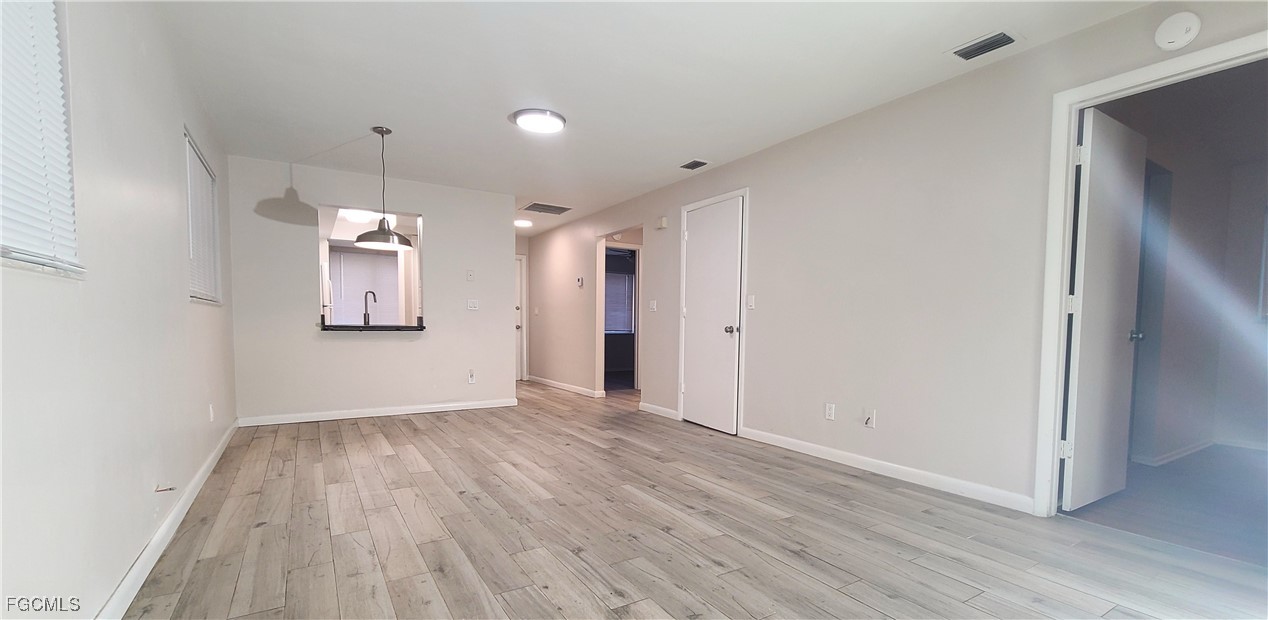 930 Southwest 47th Terrace, Unit 7 Cape Coral, FL 33914 - Photo 12 of 29 a view of empty room with wooden floor