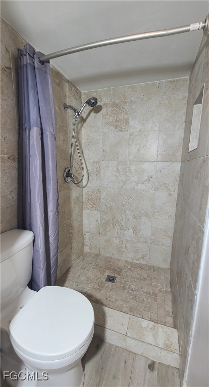930 Southwest 47th Terrace, Unit 7 Cape Coral, FL 33914 - Photo 20 of 29 a bathroom with a toilet and a shower