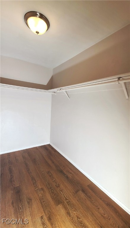 930 Southwest 47th Terrace, Unit 7 Cape Coral, FL 33914 - Photo 21 of 29 a view of an empty room with wooden floor