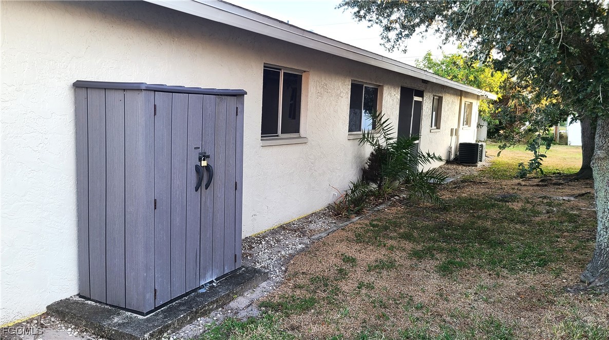 930 Southwest 47th Terrace, Unit 7 Cape Coral, FL 33914 - Photo 28 of 29 a house view with a backyard space