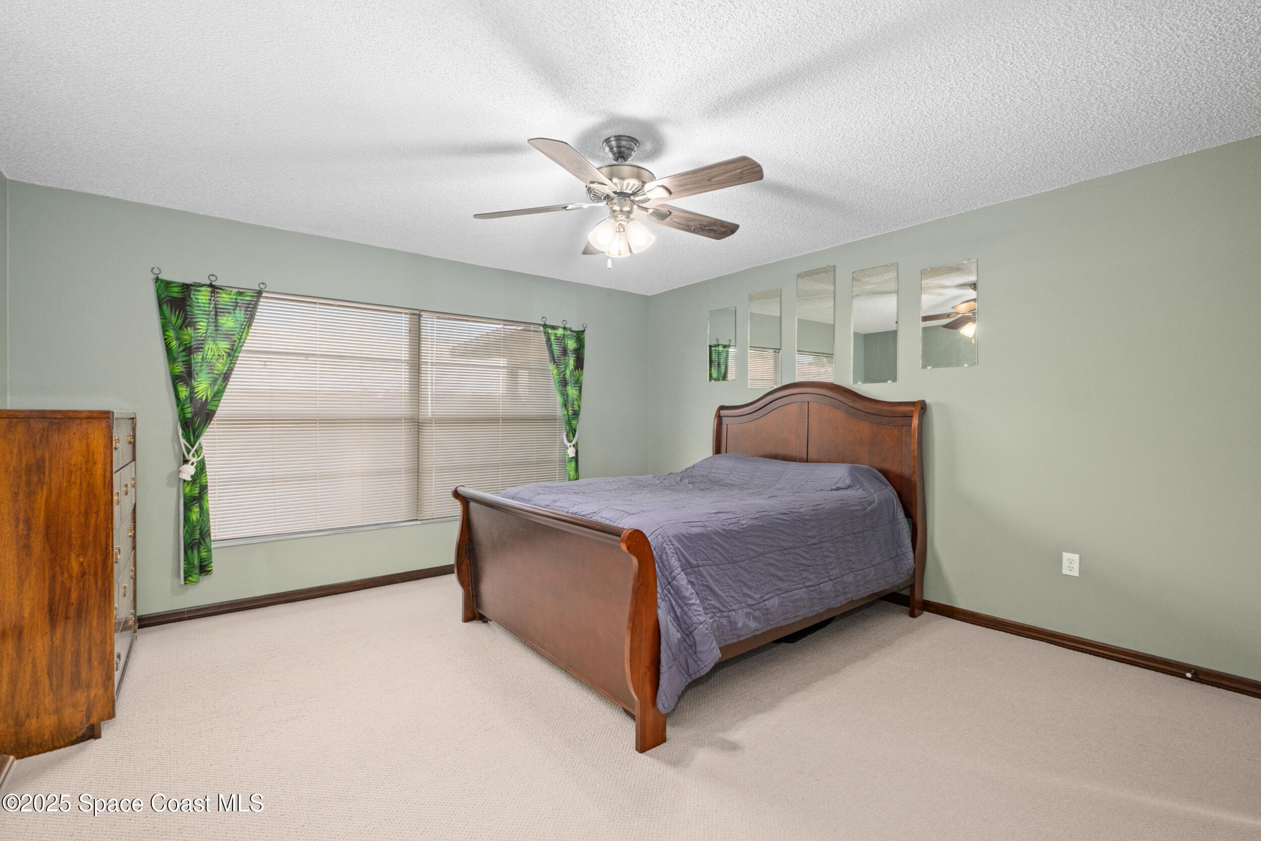 1170 Faulkingham Road Merritt Island, FL 32952 - Photo 14 of 31 a bedroom with a bed and a window