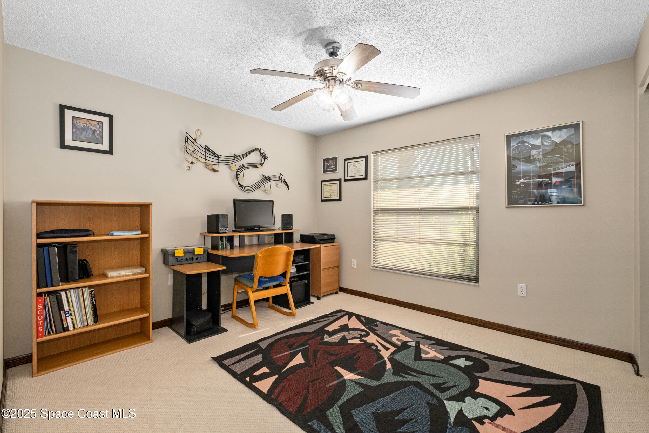 1170 Faulkingham Road Merritt Island, FL 32952 - Photo 17 of 31 a view of a workspace with furniture and a window