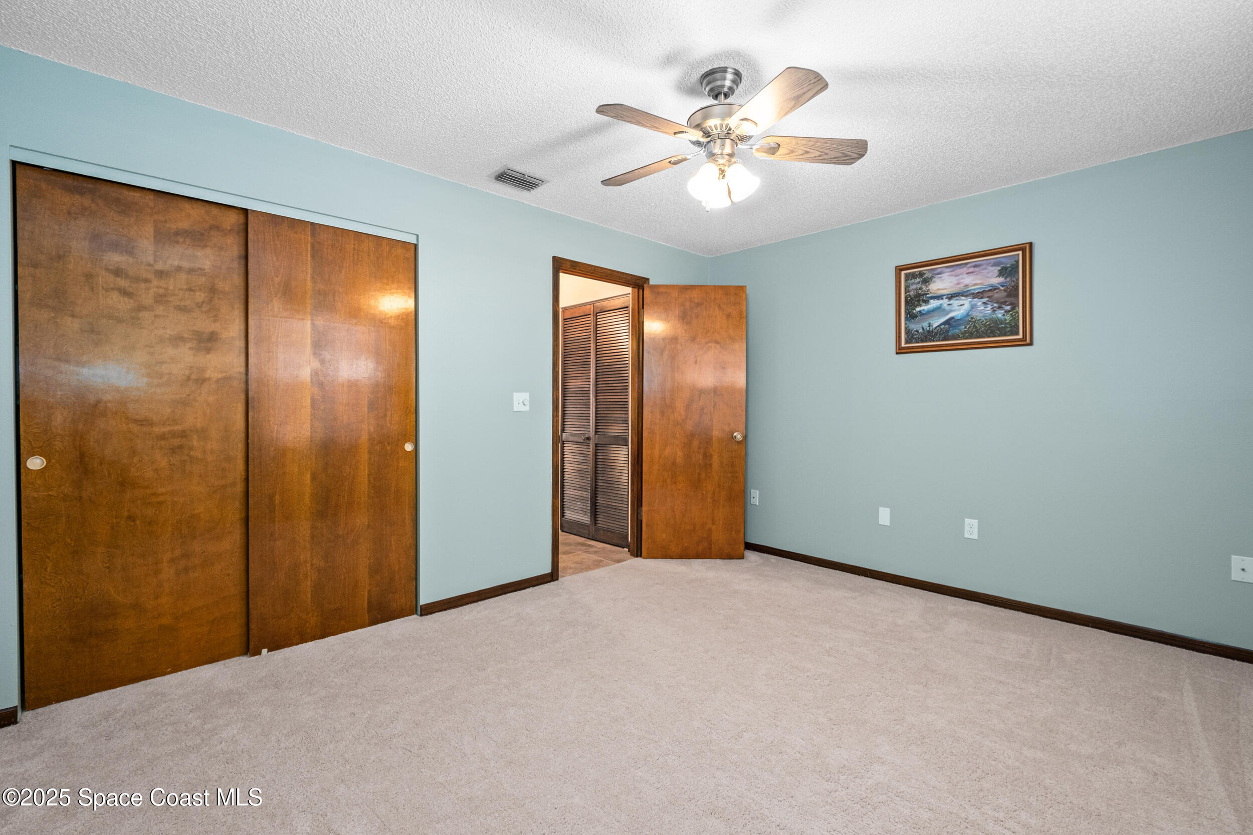 1170 Faulkingham Road Merritt Island, FL 32952 - Photo 19 of 31 a view of an empty room with a window