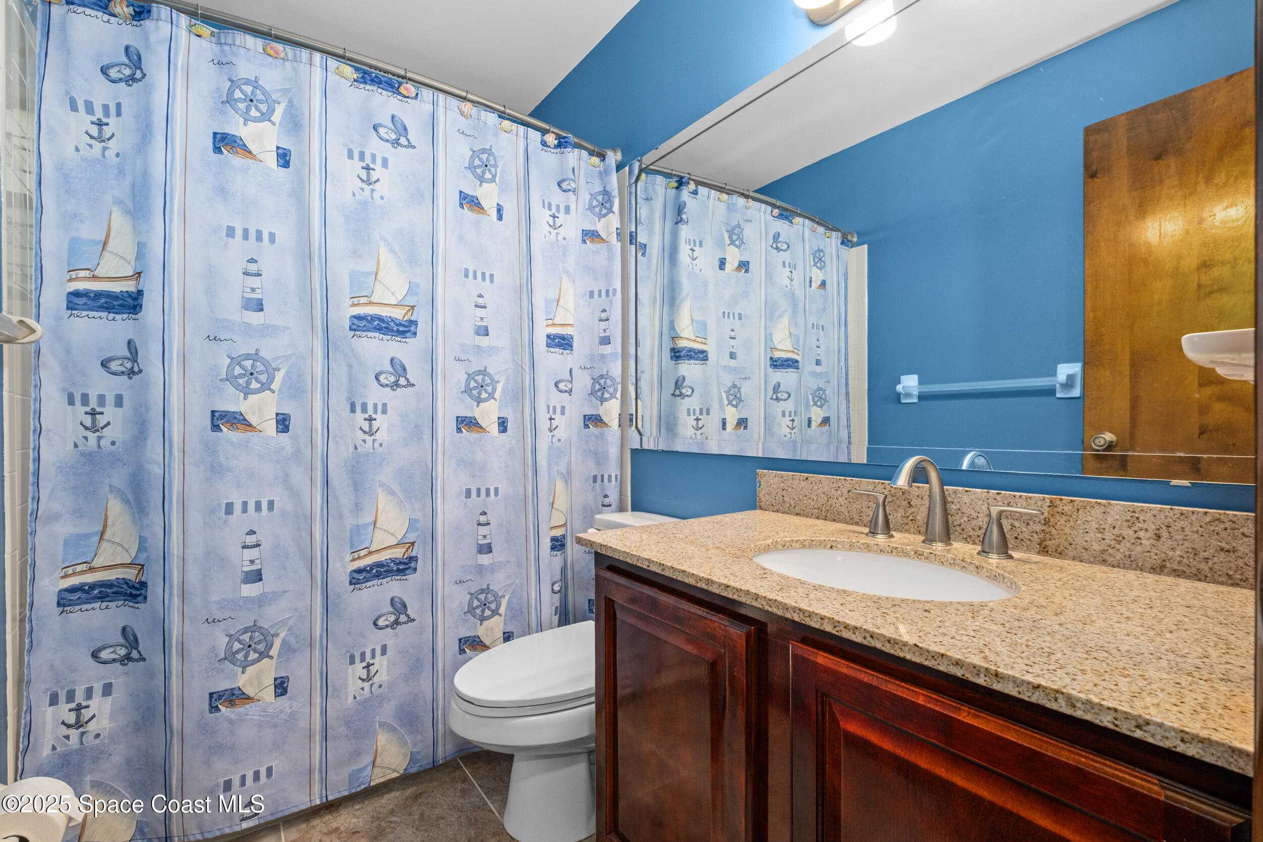 1170 Faulkingham Road Merritt Island, FL 32952 - Photo 21 of 31 a bathroom with a granite countertop sink toilet and shower