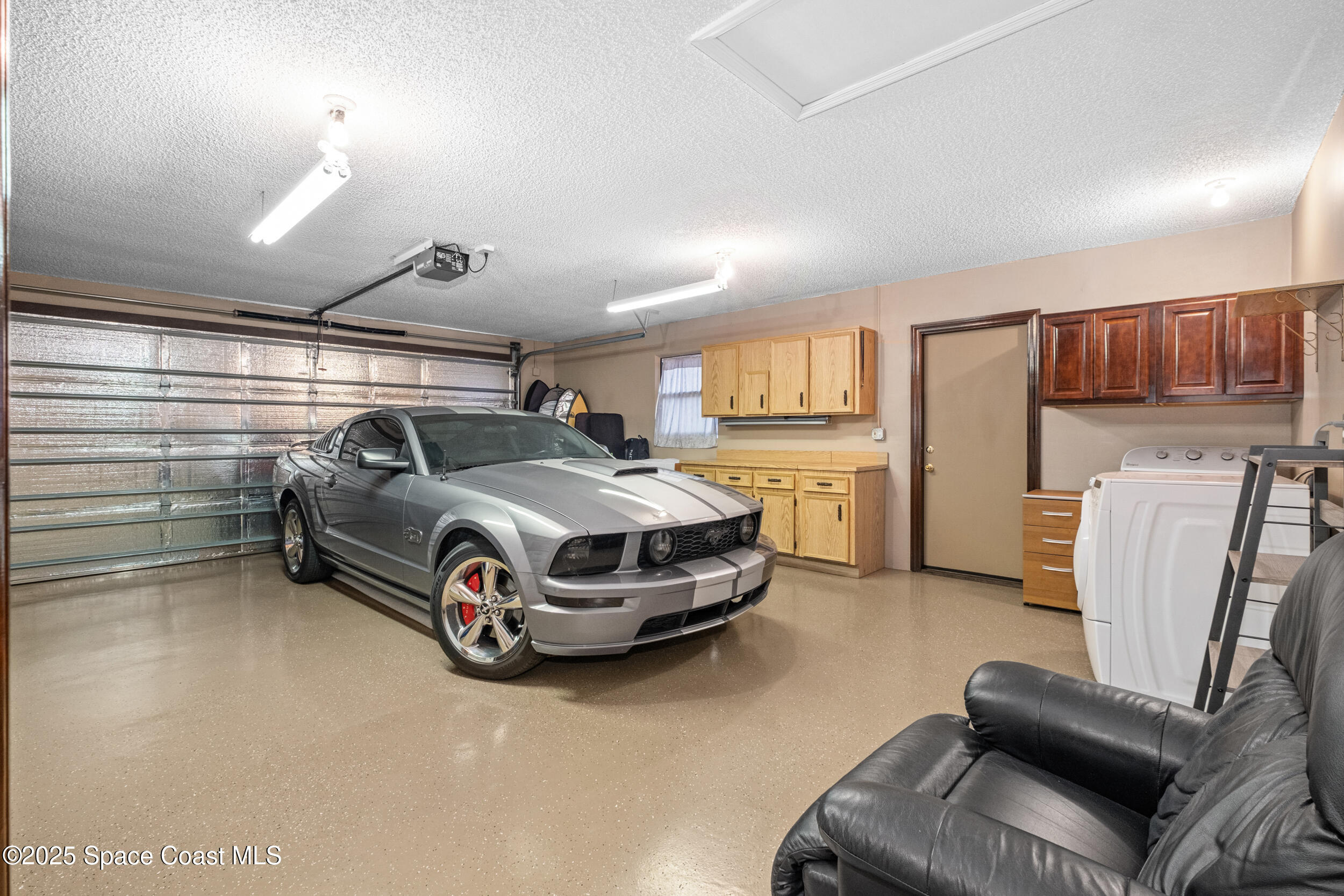 1170 Faulkingham Road Merritt Island, FL 32952 - Photo 22 of 31 a car parked in a garage