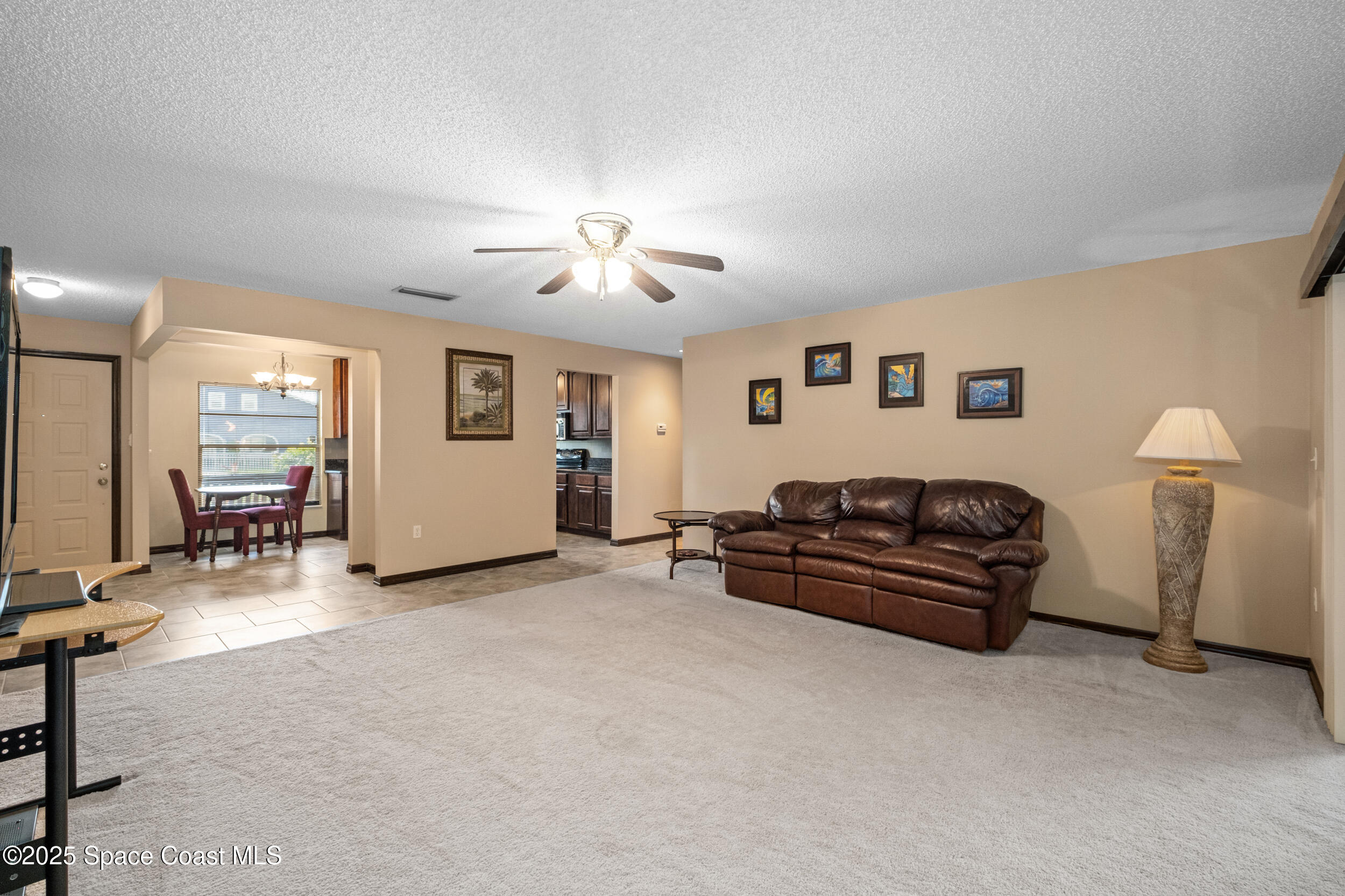 1170 Faulkingham Road Merritt Island, FL 32952 - Photo 8 of 31 a living room with furniture and a window