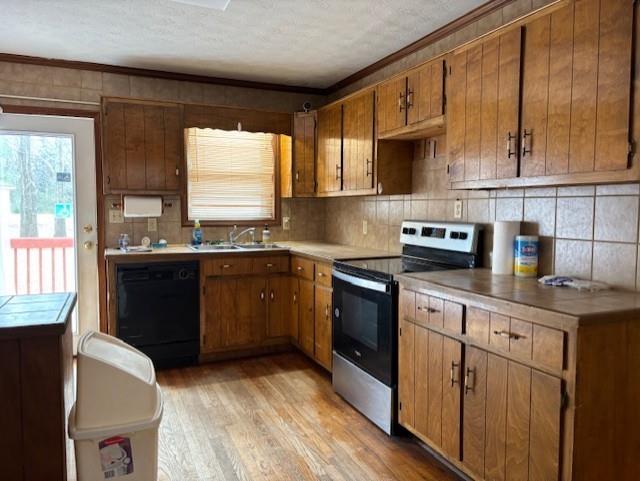 2215 Oak Hill Road Covington, GA 30016 - Photo 12 of 36 a kitchen with stainless steel appliances granite countertop a sink a stove a refrigerator cabinets and a window