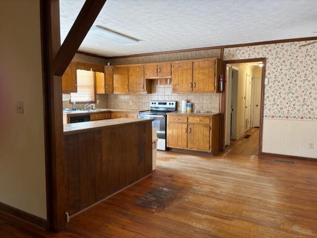 2215 Oak Hill Road Covington, GA 30016 - Photo 14 of 36 a kitchen with stainless steel appliances granite countertop a refrigerator a sink dishwasher a stove and a dining table with wooden floor