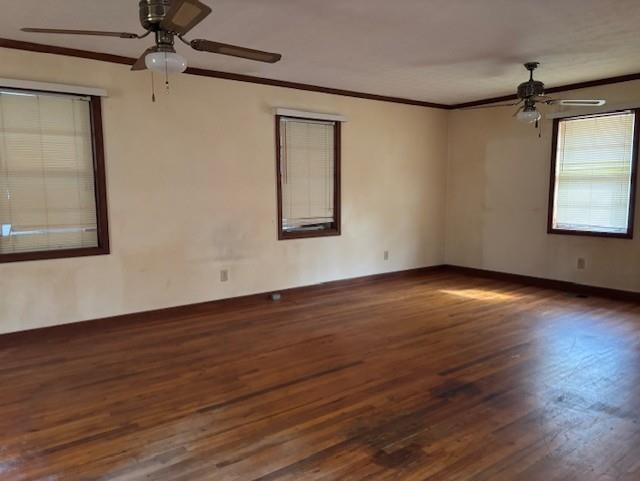 2215 Oak Hill Road Covington, GA 30016 - Photo 16 of 36 an empty room with wooden floor chandelier fan and windows
