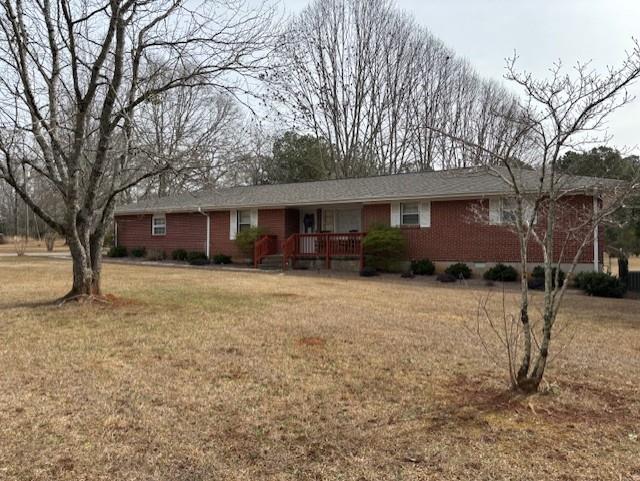 2215 Oak Hill Road Covington, GA 30016 - Photo 2 of 36 a front view of a house with a yard and garage