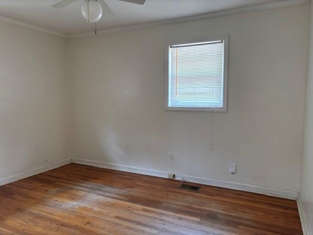 2215 Oak Hill Road Covington, GA 30016 - Photo 22 of 36 a view of an empty room with wooden floor and a window