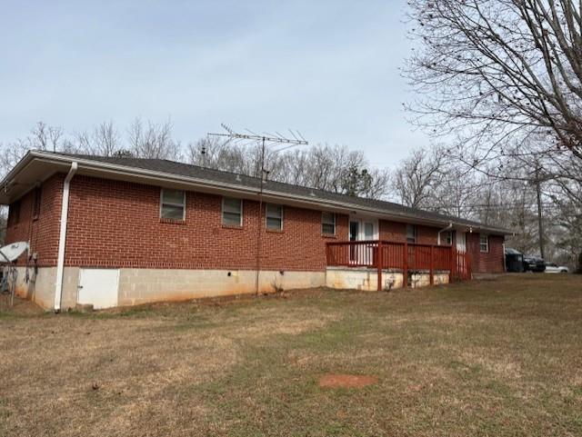 2215 Oak Hill Road Covington, GA 30016 - Photo 27 of 36 a backyard of a house with barbeque oven and yard