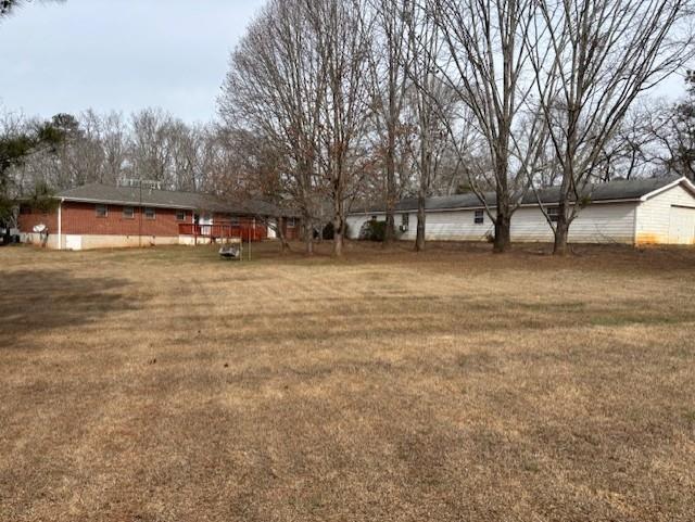 2215 Oak Hill Road Covington, GA 30016 - Photo 30 of 36 a backyard of a house with lots of green space