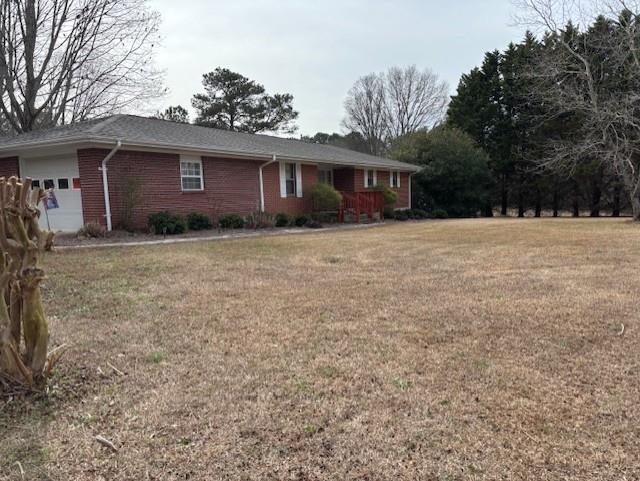 2215 Oak Hill Road Covington, GA 30016 - Photo 5 of 36 a front view of a house with yard