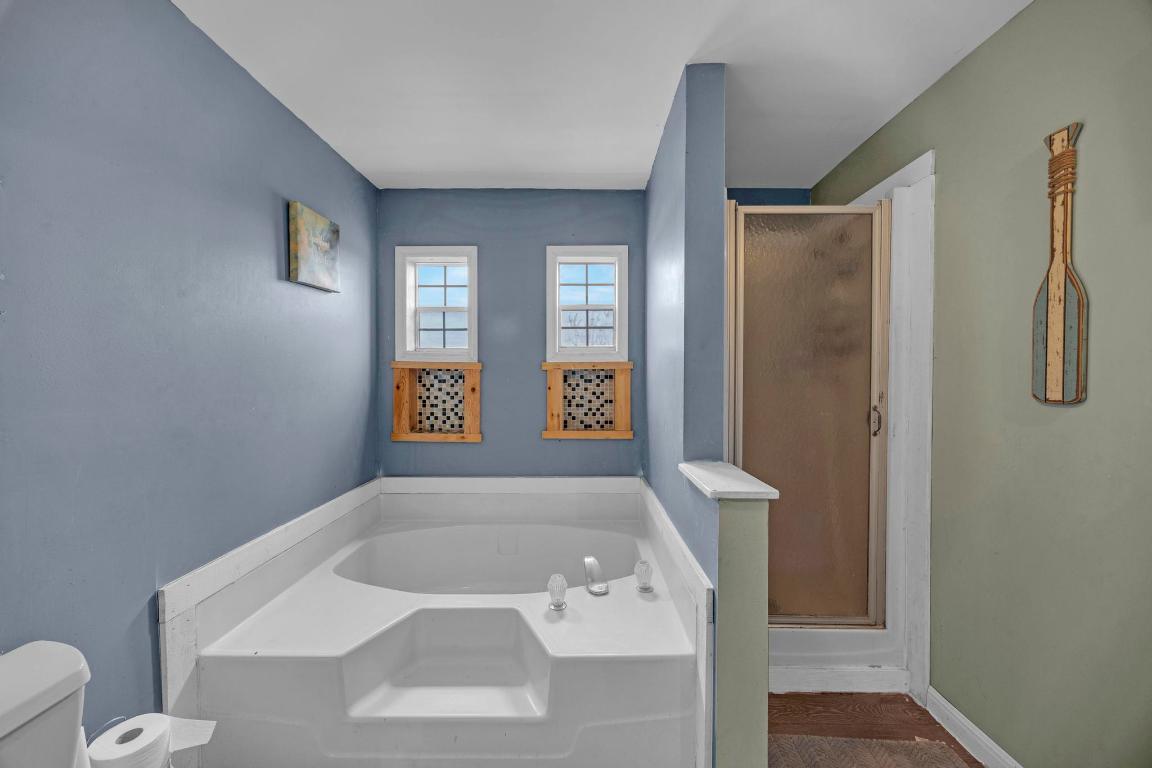 106 Cloudberry Lane Elgin, TX 78621 - Photo 20 of 33 a bathroom with a sink a toilet and shower