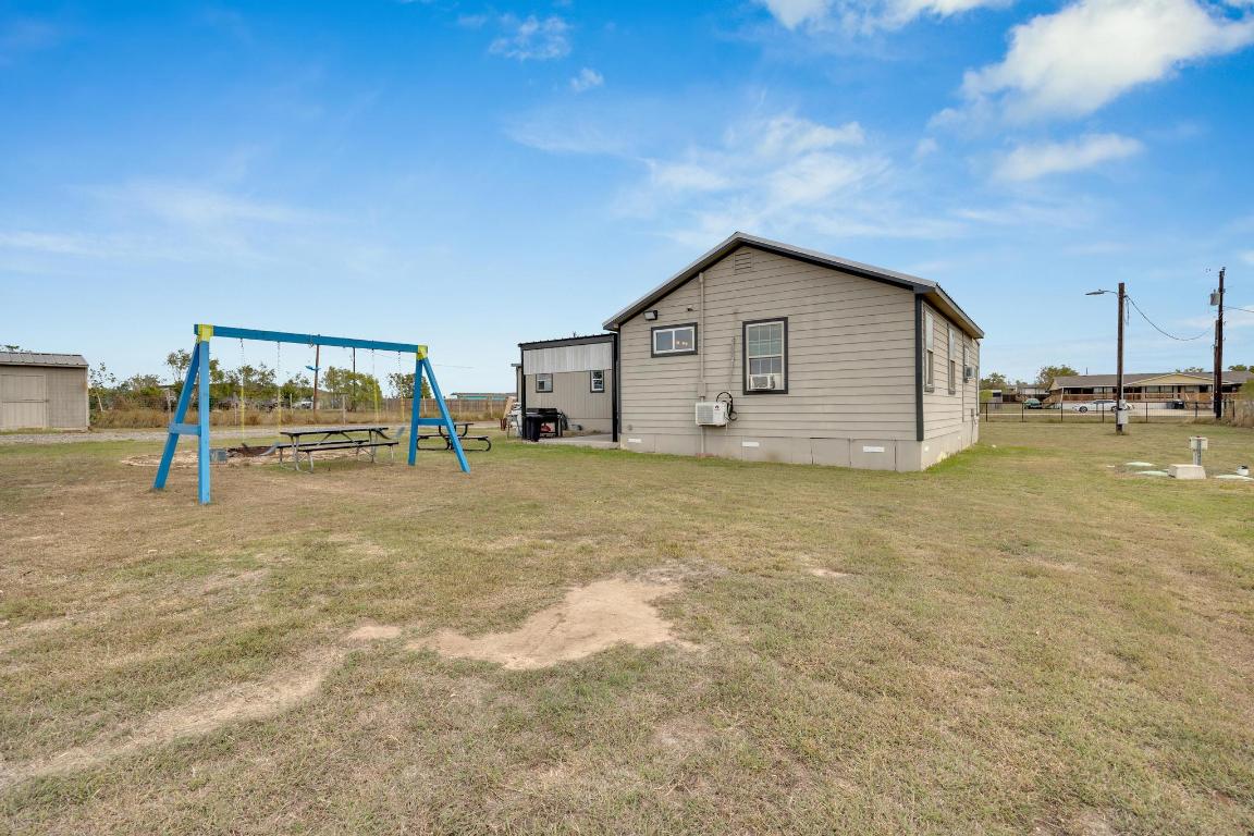 106 Cloudberry Lane Elgin, TX 78621 - Photo 27 of 33 a view of an house with backyard space