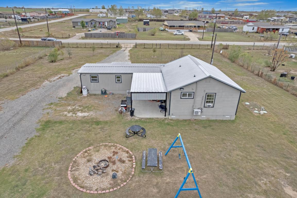106 Cloudberry Lane Elgin, TX 78621 - Photo 33 of 33 an aerial view of a house with a ocean view