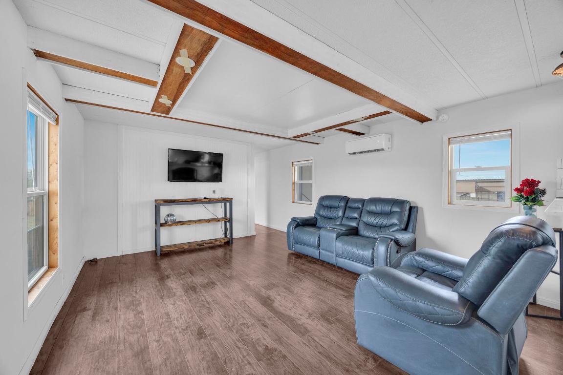 106 Cloudberry Lane Elgin, TX 78621 - Photo 8 of 33 a living room with furniture and a wooden floor