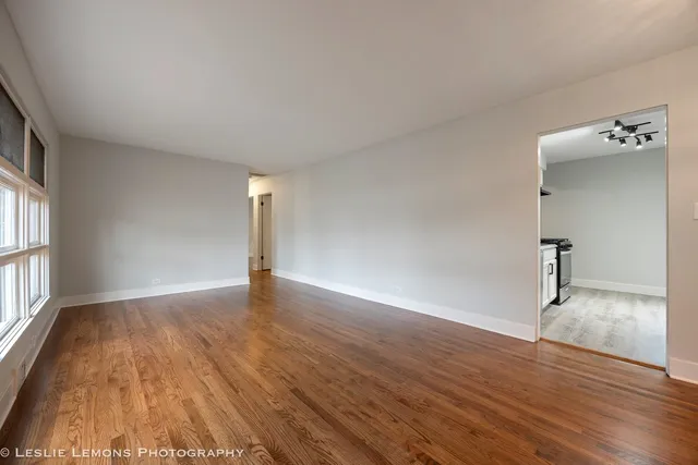 a view of a livingroom with wooden floor