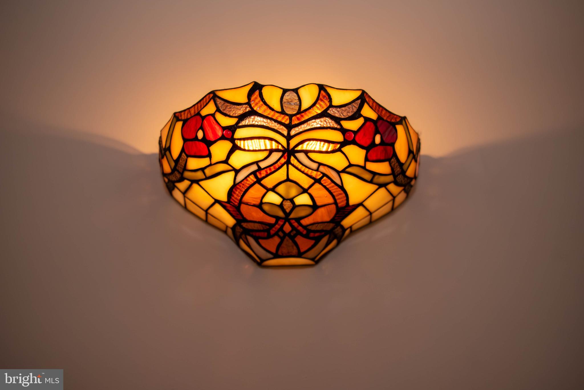 792 Forest Glen Road Moorefield, WV 26836 - Photo 109 of 146 Stunning stained glass wall sconce.