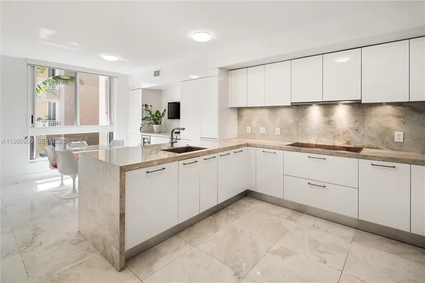 a kitchen with a sink and cabinets
