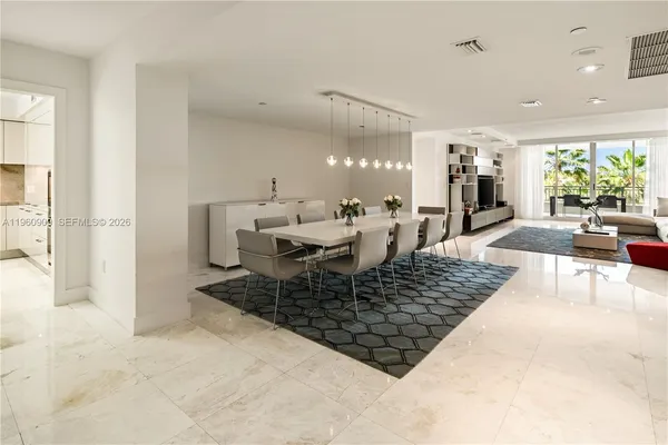 a living room with furniture and a rug