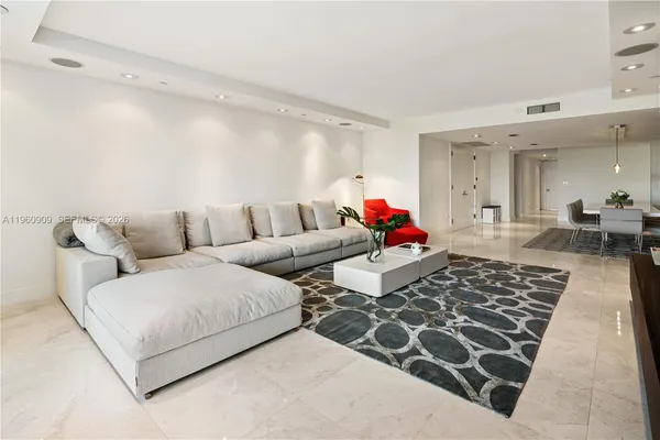 a living room with furniture and a rug