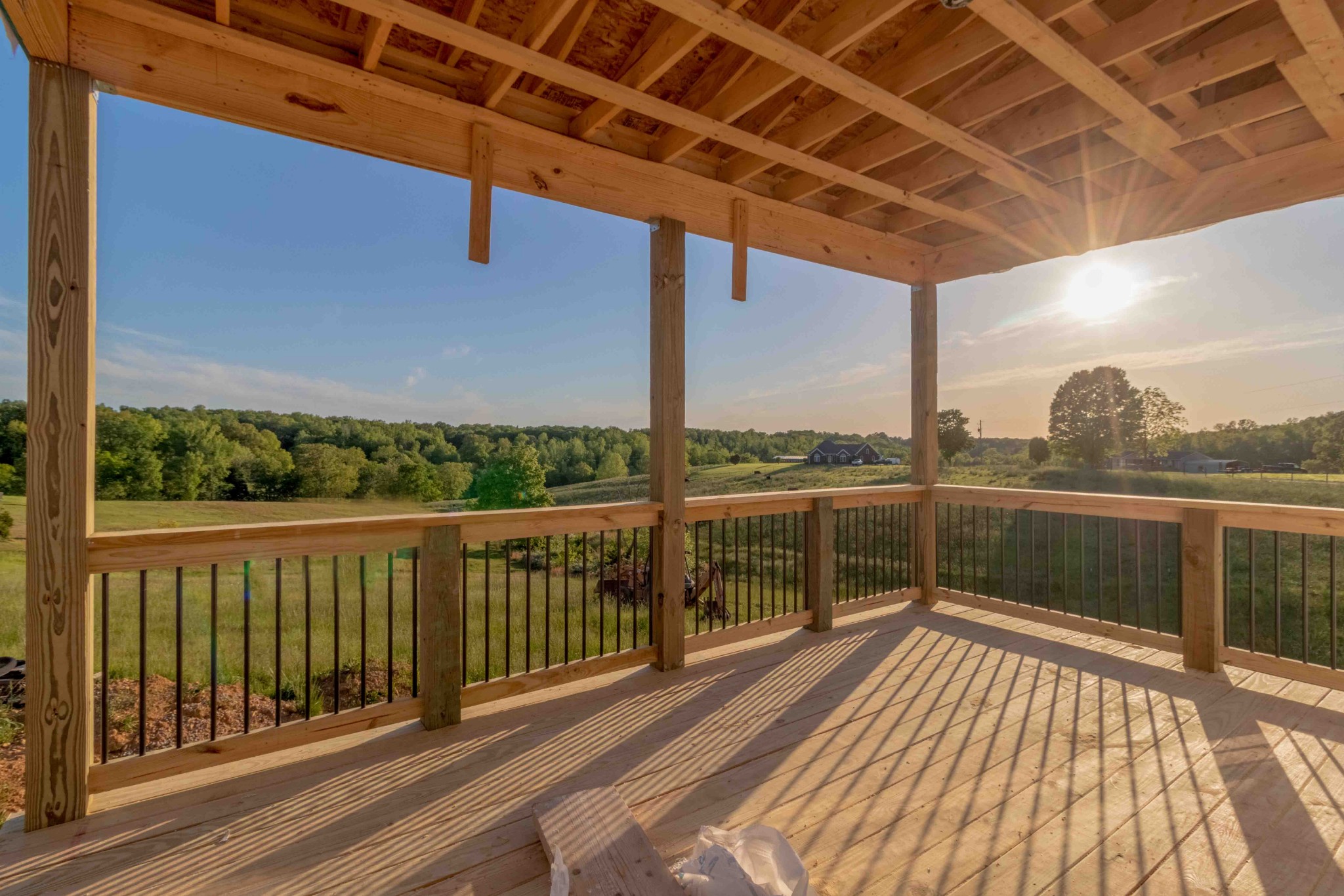a view of balcony with wooden floor