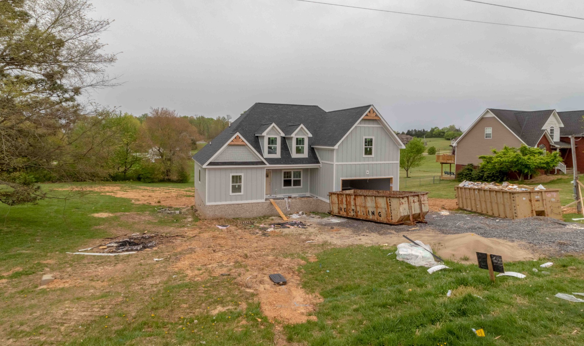 1416 Hickory Point Road Clarksville, TN 37043 - Photo 16 of 18 a view of a house with a big yard and large trees