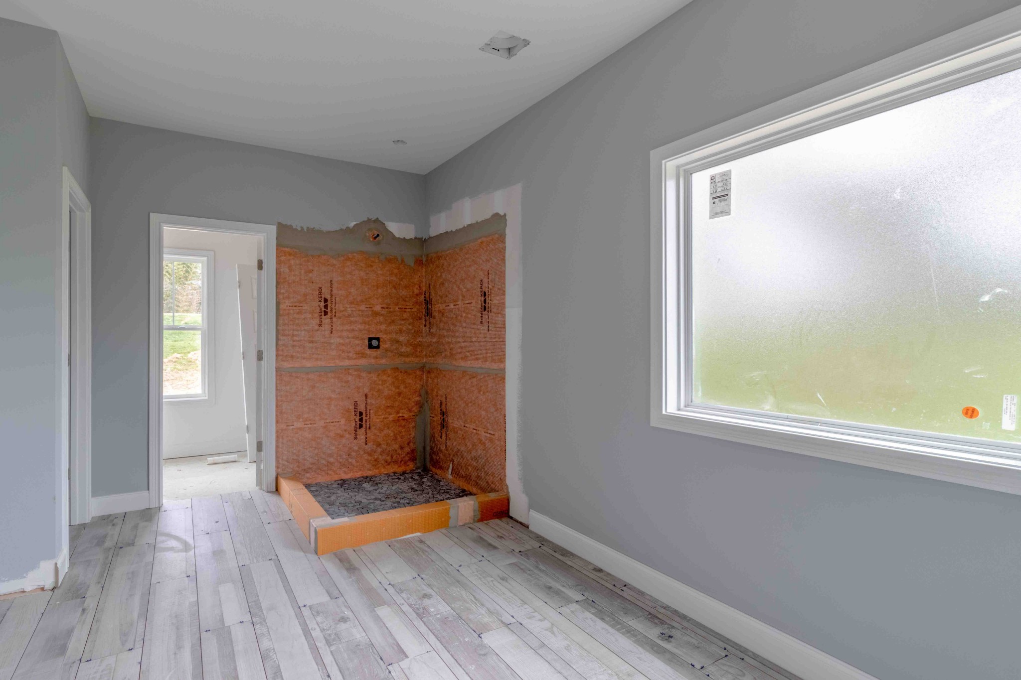 1416 Hickory Point Road Clarksville, TN 37043 - Photo 8 of 18 a view of an empty room with wooden floor and a window