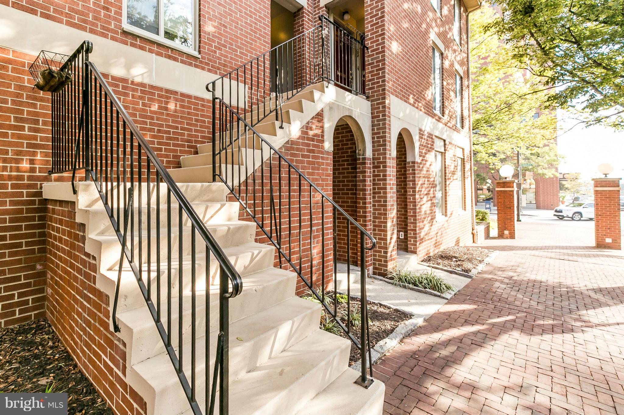 2 West Lee Street, Unit R59 Baltimore, MD 21201 - Photo 2 of 28 a view of a brick building with many windows