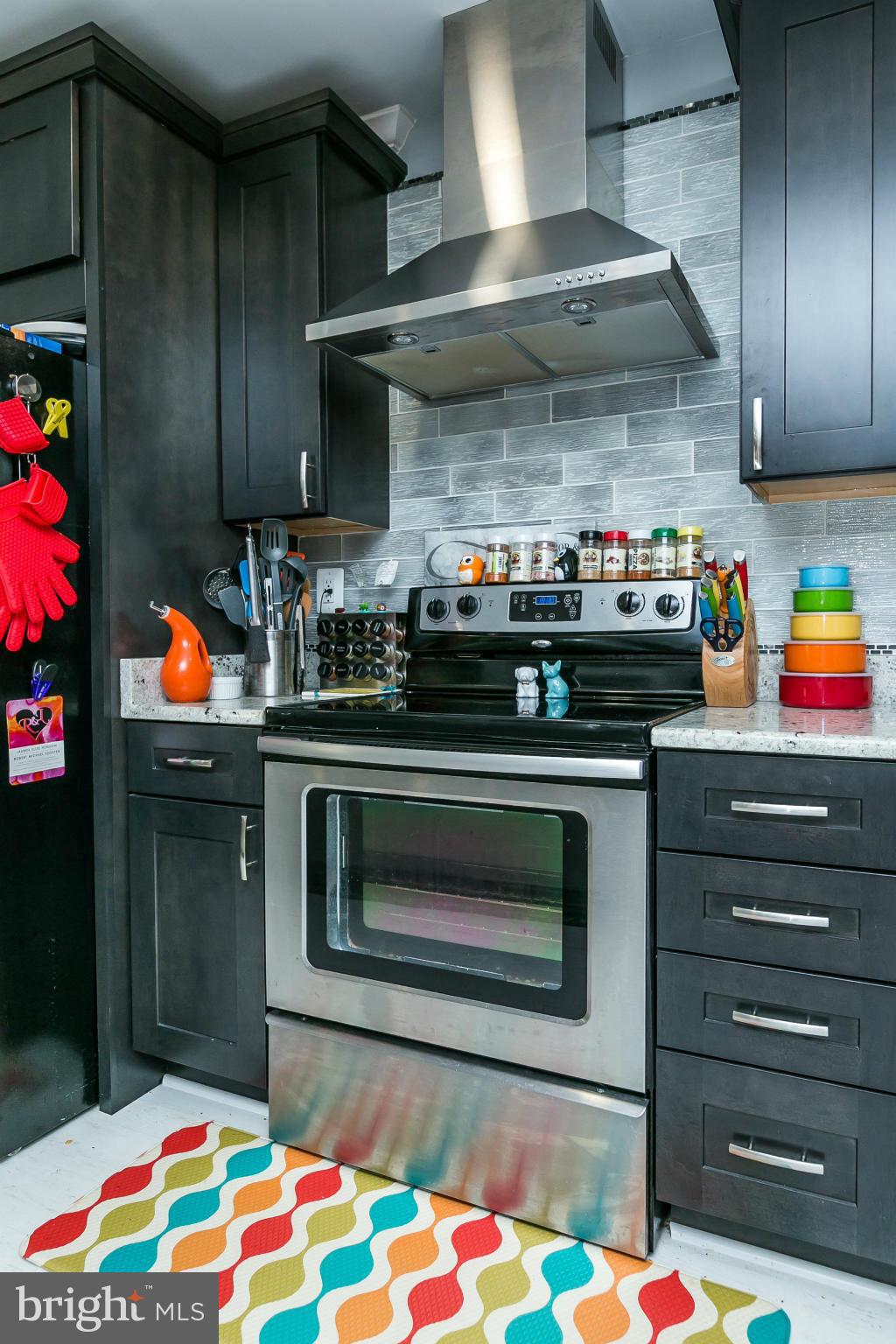2 West Lee Street, Unit R59 Baltimore, MD 21201 - Photo 12 of 28 a stove top oven sitting inside of a kitchen