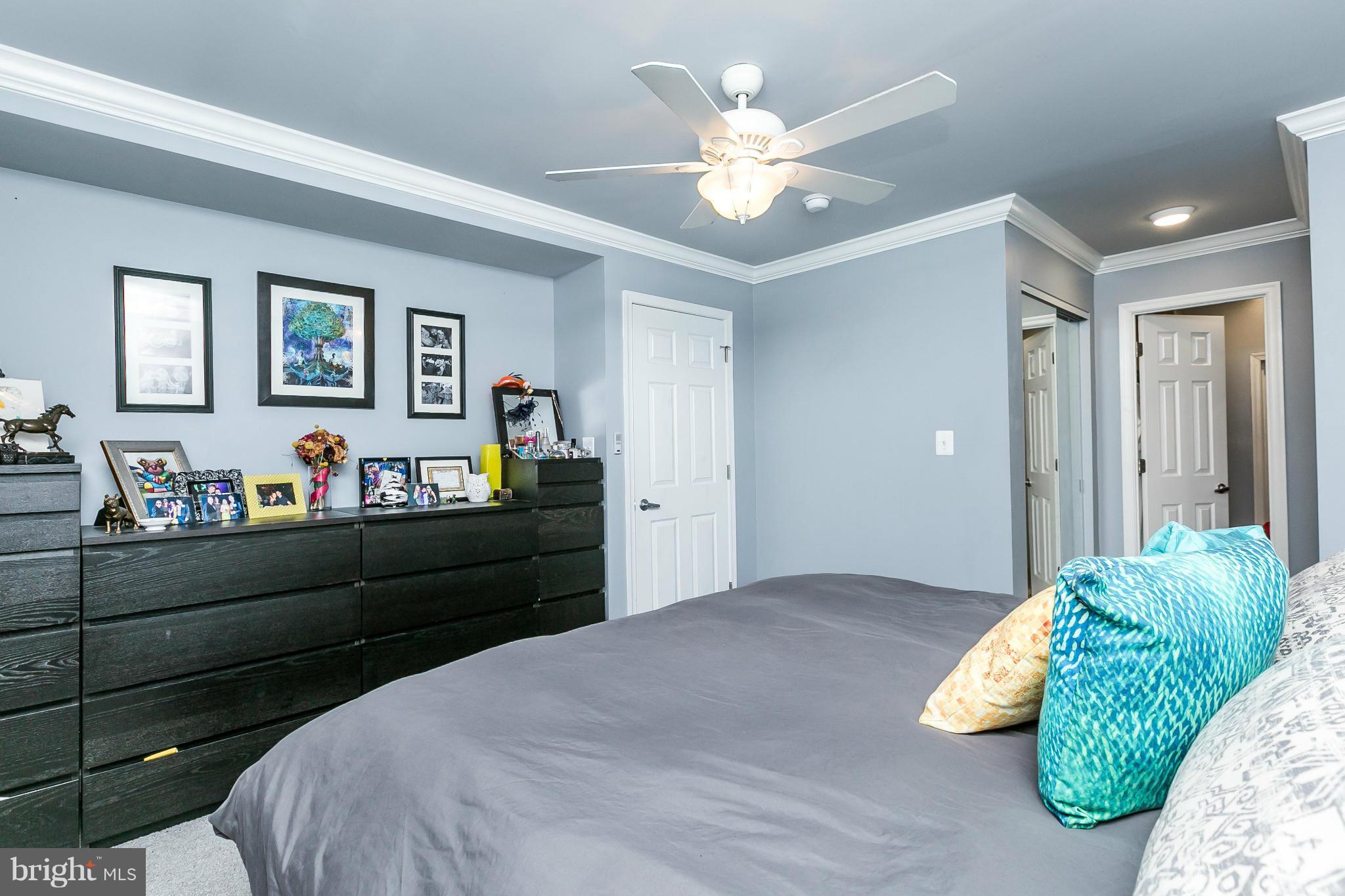 2 West Lee Street, Unit R59 Baltimore, MD 21201 - Photo 17 of 28 a bed room with bed and a chandelier