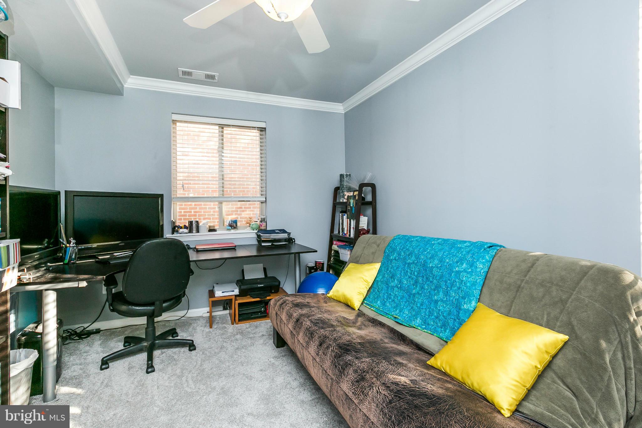 2 West Lee Street, Unit R59 Baltimore, MD 21201 - Photo 21 of 28 a living room with furniture and a flat screen tv