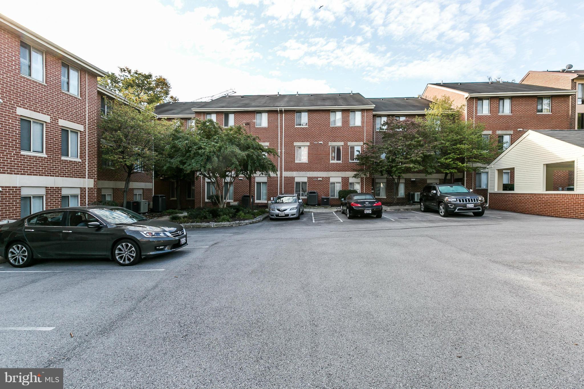 2 West Lee Street, Unit R59 Baltimore, MD 21201 - Photo 27 of 28 a car parked in front of a building