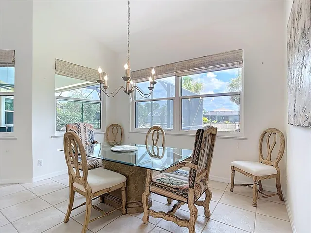 a bedroom with a bed a mirror and a window