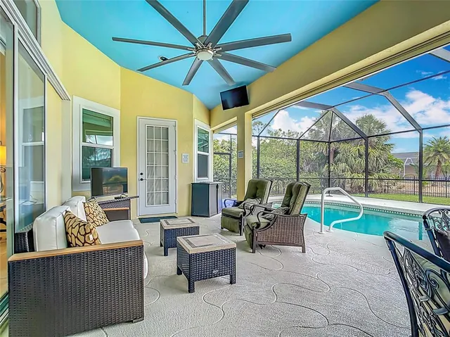 a view of a dining room with furniture and chandelier