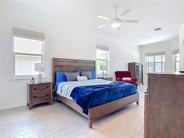 a bathroom with a toilet a sink and a window